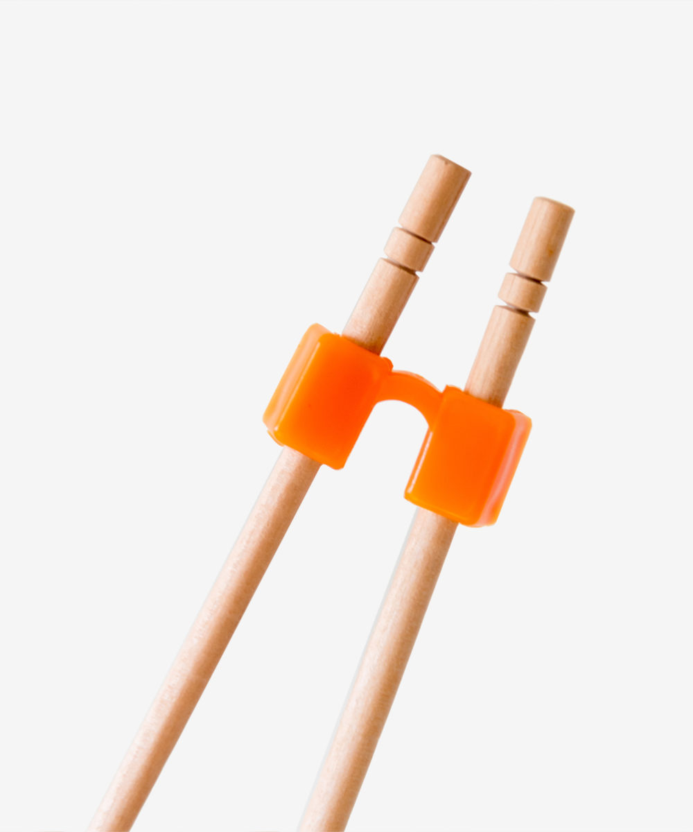 Пластикові тримачі для суші паличок, Дитячі палички для їжі, навчальні палички для суші. Палички для їжі навчальні - купити прищіпки для паличок учнівські. Насадки тренувальні для китайських японських паличок.